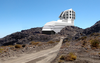 A photograph and a rendering mix, showing a view of the LSST's exterior building.